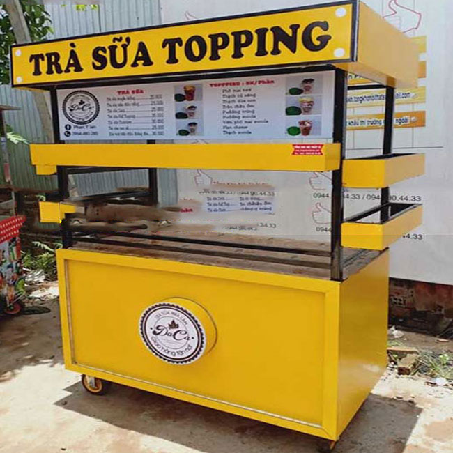Xe đẩy bán trà sữa màu vàng